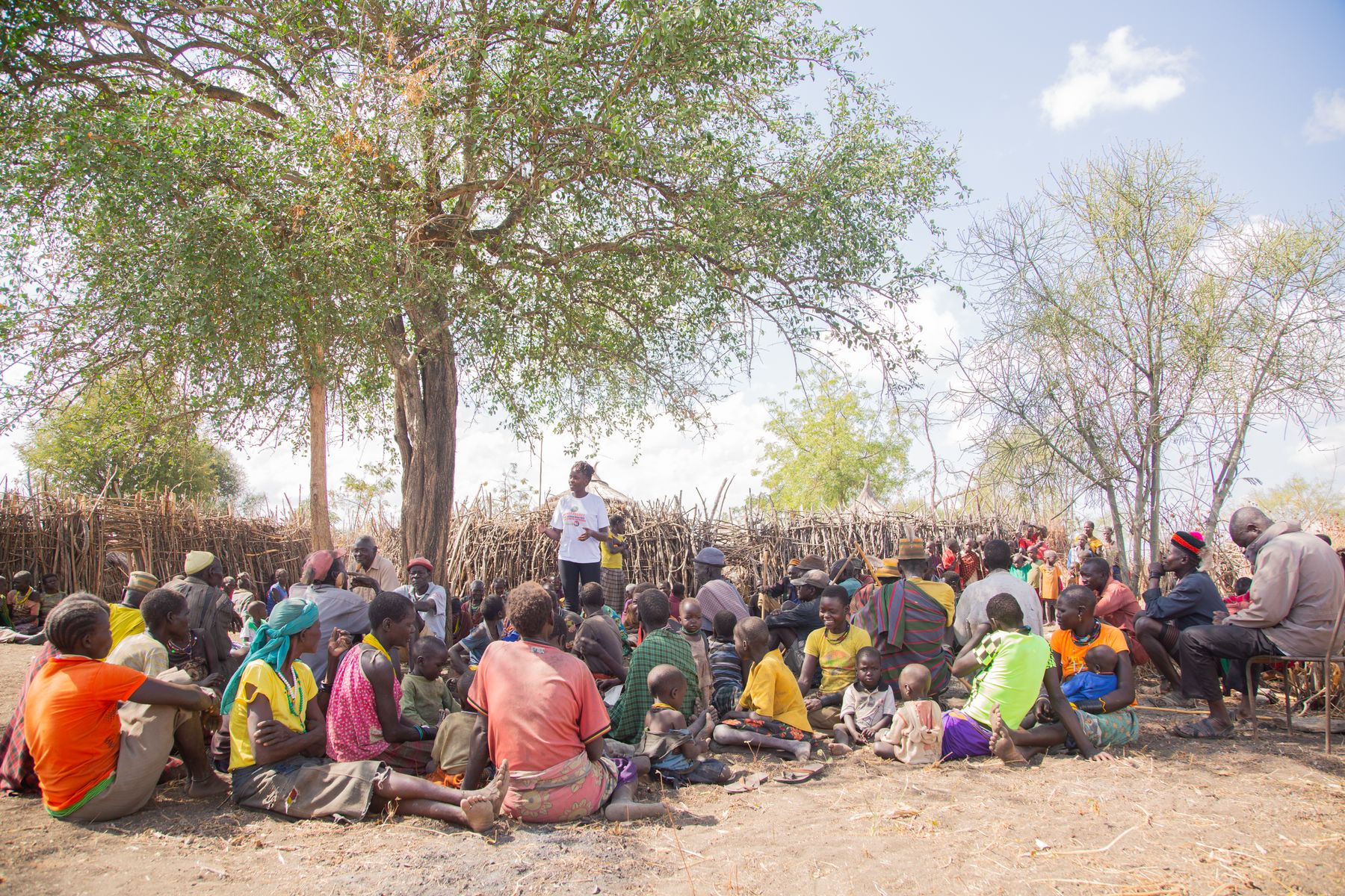 Members of a Ugandan community gathered outdoors